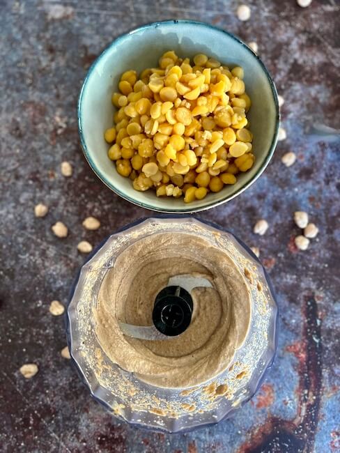 How to fix lumpy hummus - bowl of whole chickpeas, rest of ingredients in the food processor