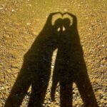 Can a vegan date a meat eater? Shadows of two people intertwined to make hearts