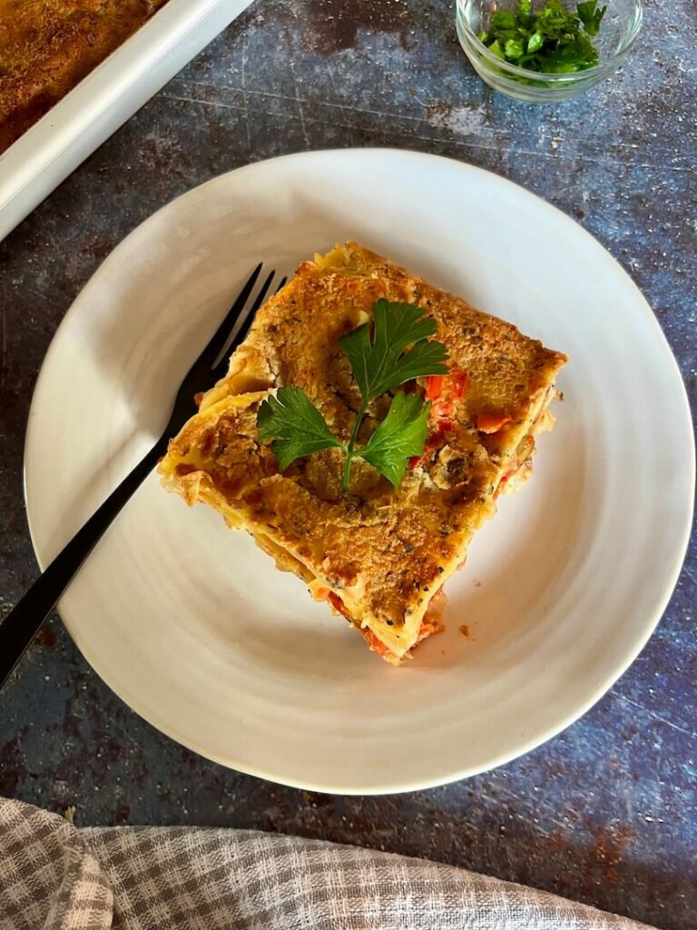Portion of oil free, gluten free, vegan lasagne on a plate.