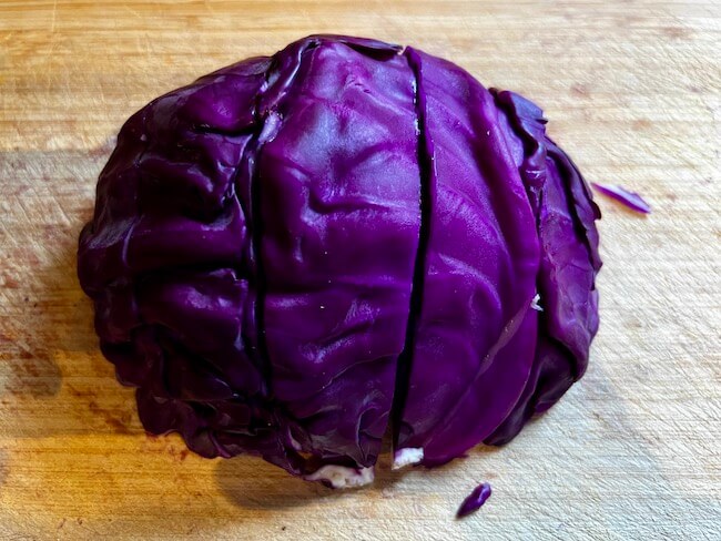 Whole purple cabbage sliced into wedges