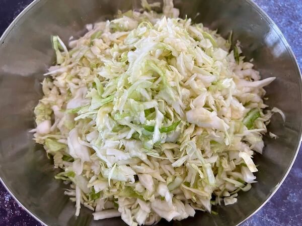 Is sauerkraut vegan friendly? Yes it is as the ingredients are just salted shredded cabbage as shown in the image. 