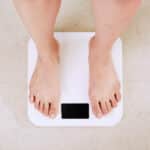 Why isn't OMAD working for me? Picture of somebody's feet standing on the weighing scales