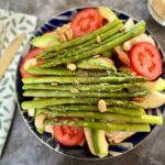 Favourite way to eat asparagus? bowl of salad topped with lots of asparagus spears