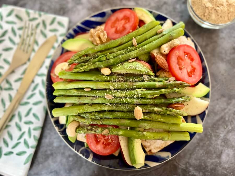 Favourite way to eat asparagus? bowl of salad topped with lots of asparagus spears